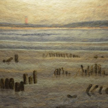 Schilderij van een strand, gemaakt met wol