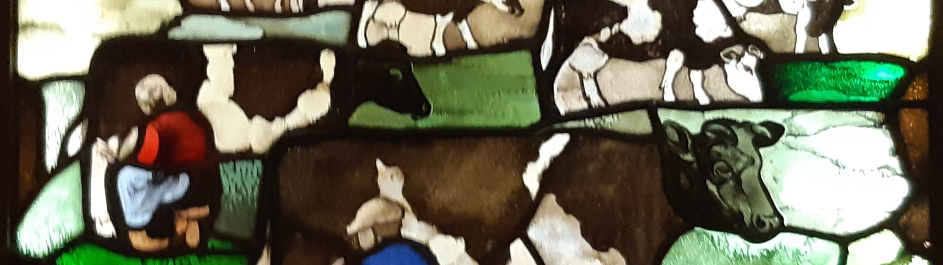 Melkende boer en vrouw in glas-in-lood